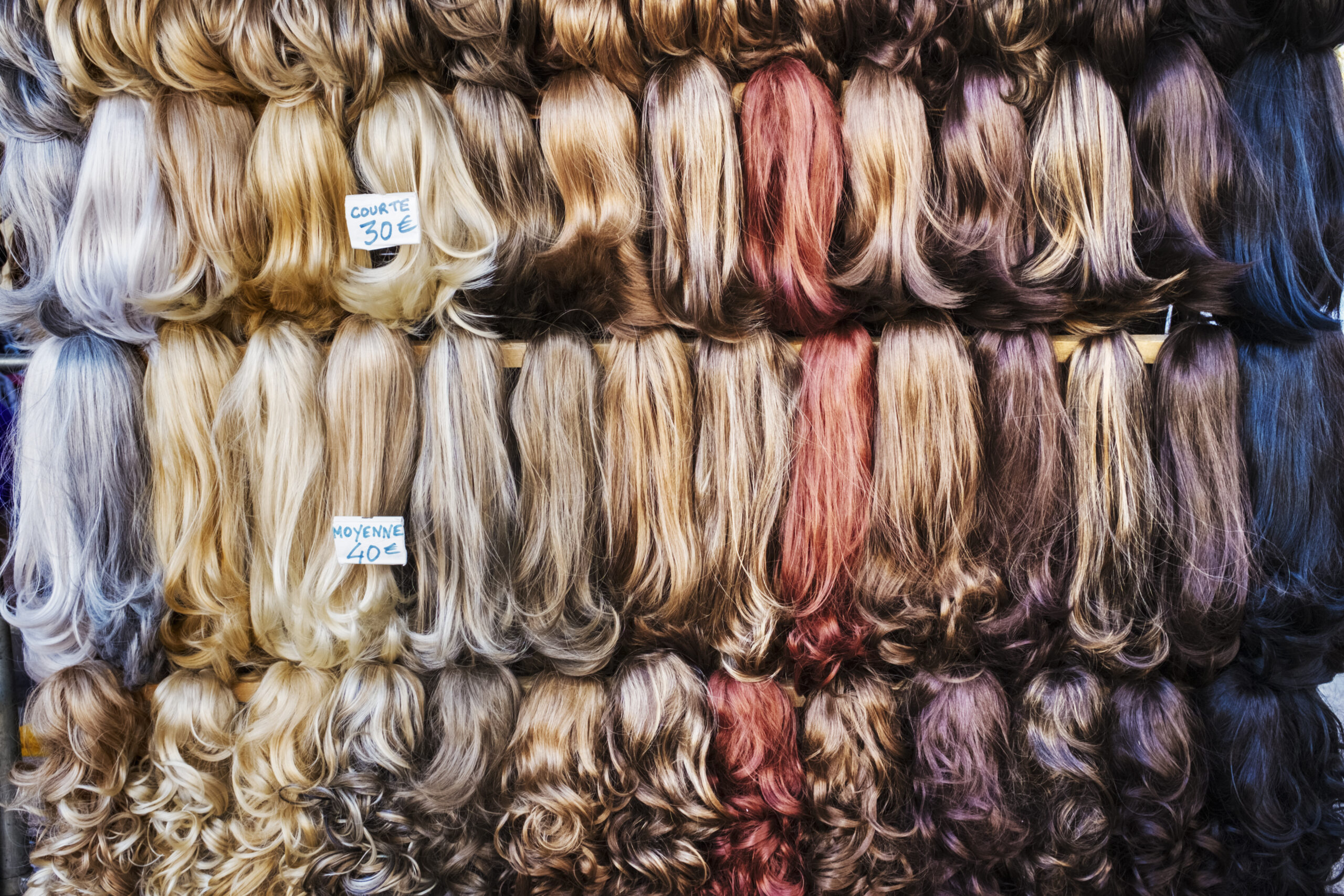 A display of hair extensions and hair pieces of different colours. ,France